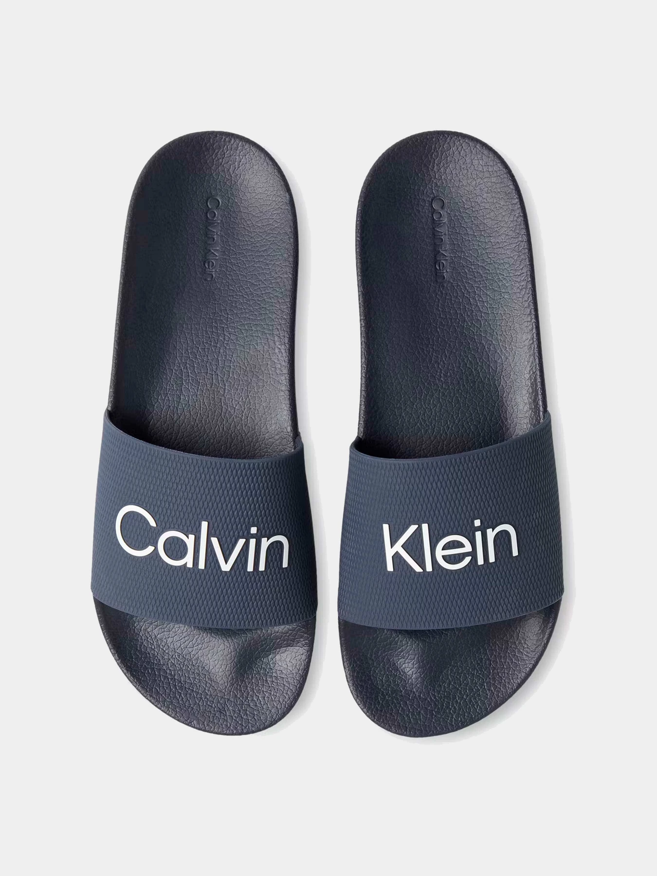 Шлёпанцы Calvin Klein модель HM0HM01000-DW4 Шлёпанцы Calvin Klein модель HM0HM01000-DW4 Фото