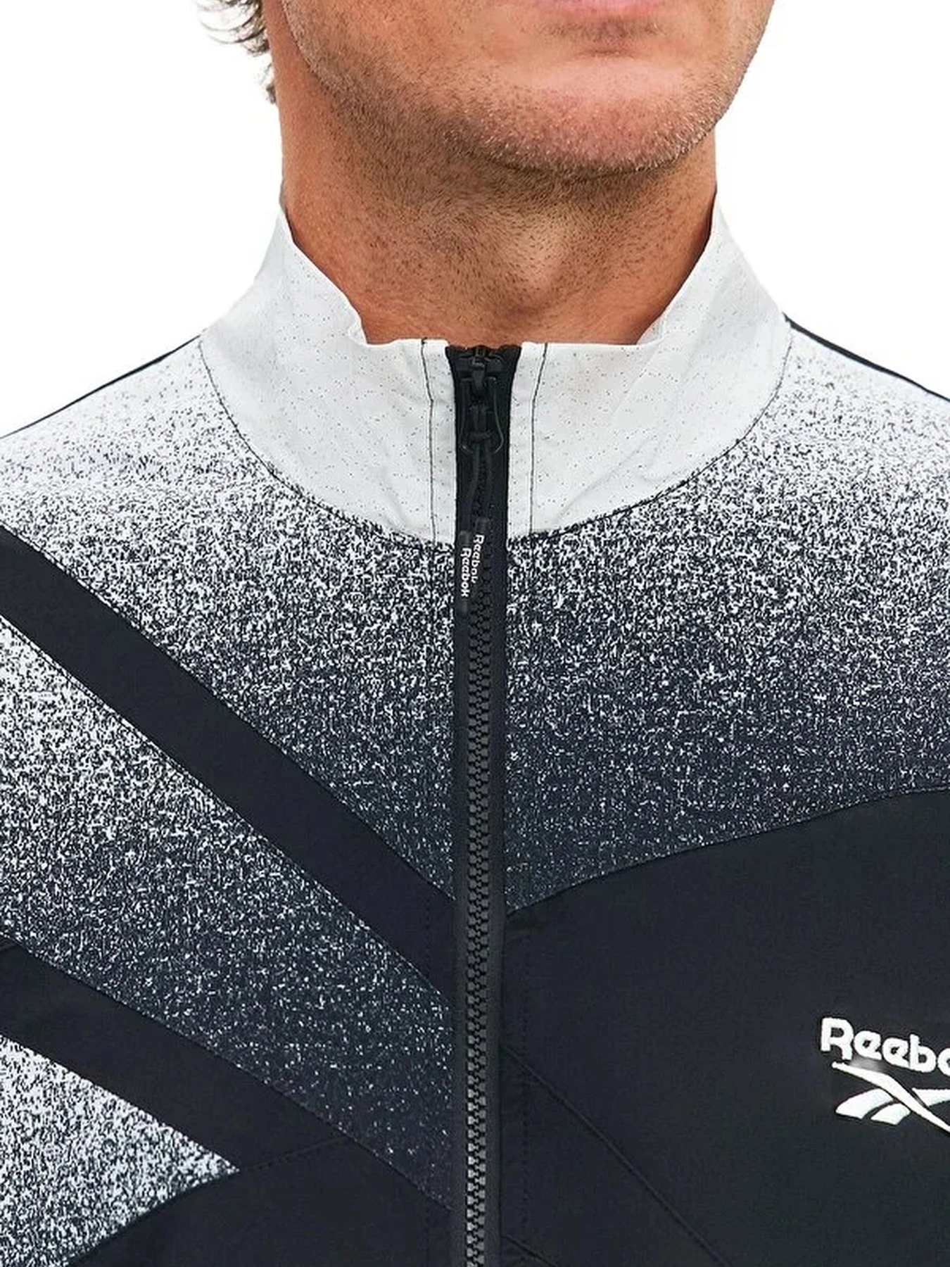 Куртки и дубленки Reebok VECTOR SPRAY PRINT TRACK модель 102248289 Куртки и дубленки Reebok VECTOR SPRAY PRINT TRACK модель 102248289 Фото